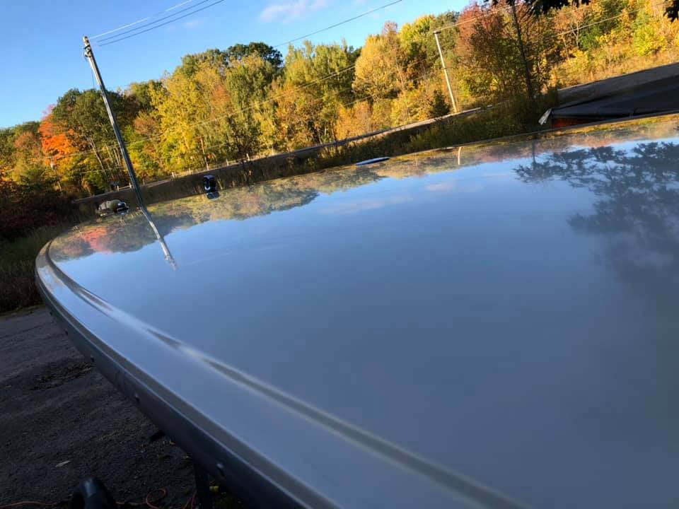 Dazzling top of a Donzi speedboat after professional boat detailing by True North Detailing Muskoka, showing clear reflections.