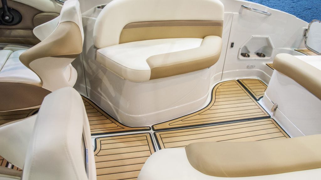 Immaculate boat interior detailing by True North Detailing Muskoka, showing clean brown and off-white seats and deck.